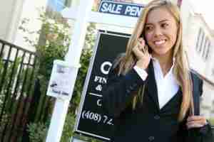 realtor in front of house